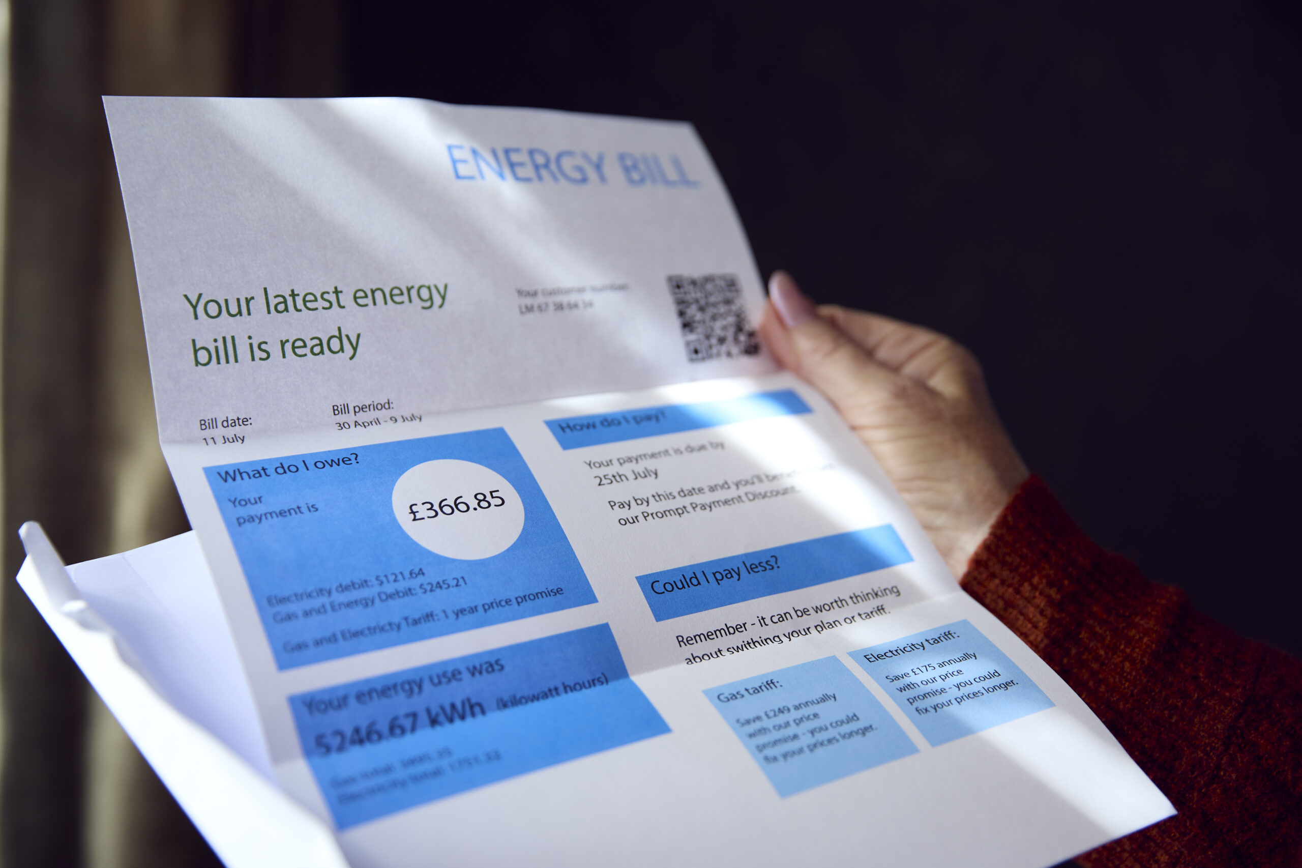 close up of senior woman opening uk energy bill co 2024 10 21 09 44 46 utc scaled